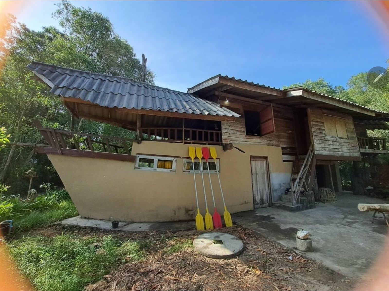 Boat House 2 exterior with kayak paddles